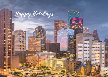 An exciting Houston holiday card featuring the evening lighted downtown skyline